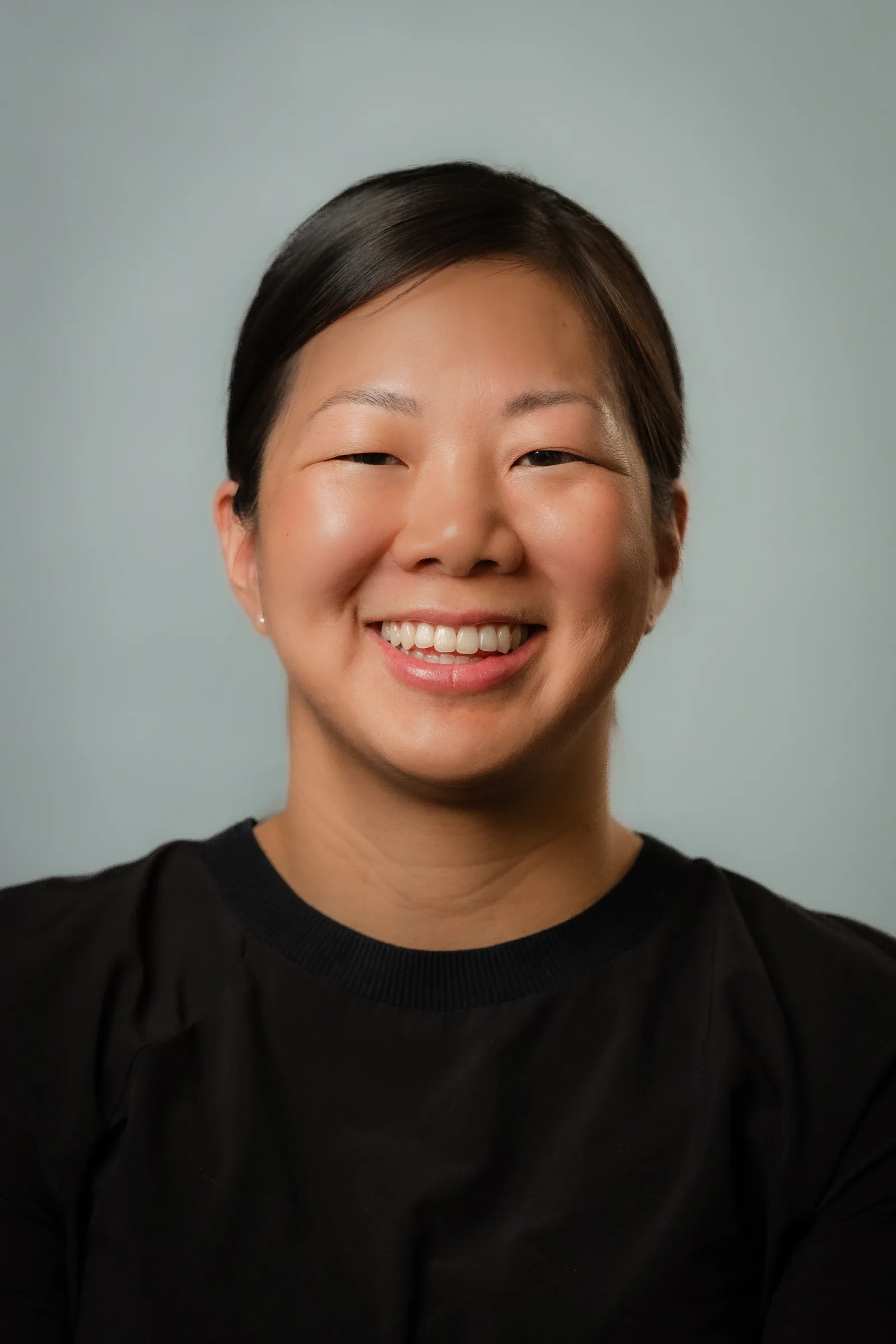Dr. Erica Wong smiling, in a close portrait
