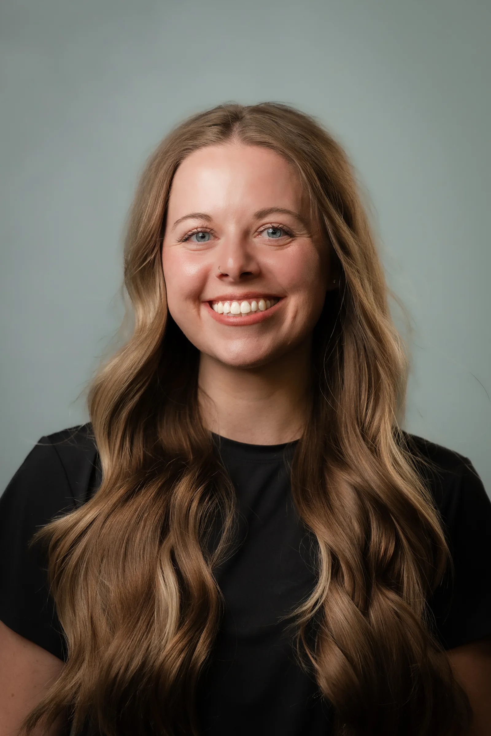 Dr. Minija Edgar smiling, in a close portrait